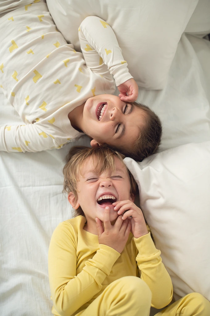 2 toddler boys laughing